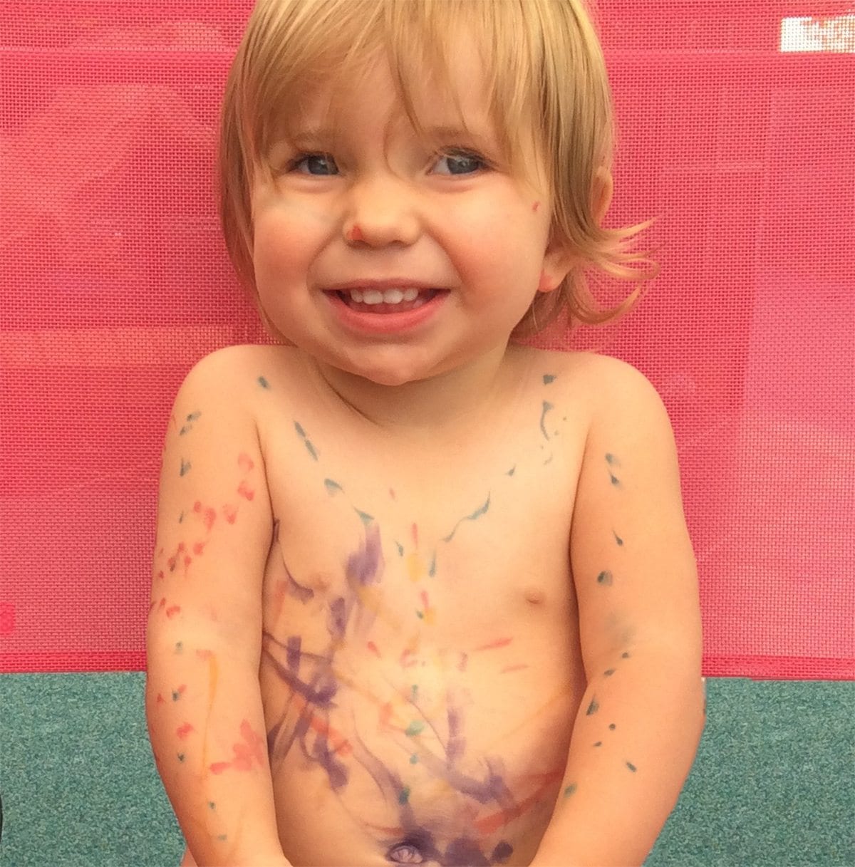 paint toddlers body with felt tip marker drawing